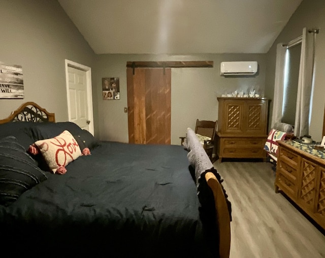 690 Ditch Gap Rd, Whitwell, TN 37397 - bedroom with vaulted ceiling, light wood-style flooring, and a wall mounted air conditioner