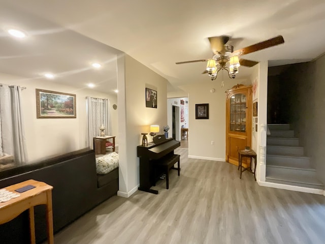 690 Ditch Gap Rd, Whitwell, TN 37397 - living area featuring light wood-style floors, ceiling fan, baseboards, stairs, and recessed lighting
