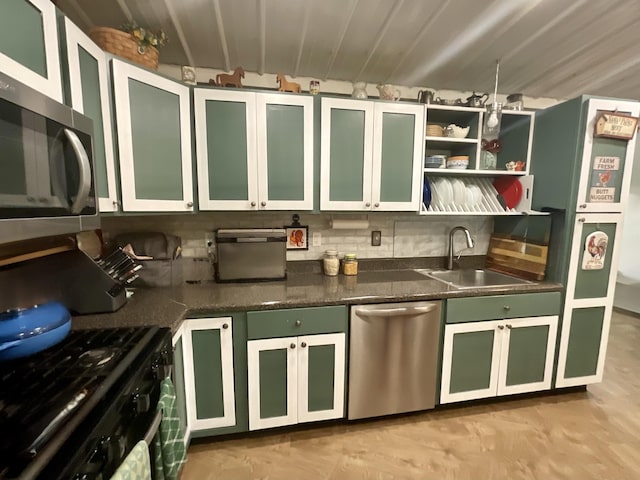 690 Ditch Gap Rd, Whitwell, TN 37397 - kitchen with stainless steel appliances, a sink, green cabinets, and backsplash