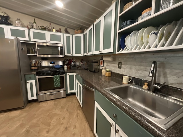 690 Ditch Gap Rd, Whitwell, TN 37397 - kitchen with appliances with stainless steel finishes, a sink, dark countertops, decorative backsplash, and lofted ceiling