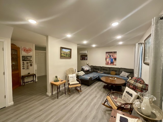 690 Ditch Gap Rd, Whitwell, TN 37397 - living area featuring light wood-style floors, a wall unit AC, baseboards, and recessed lighting