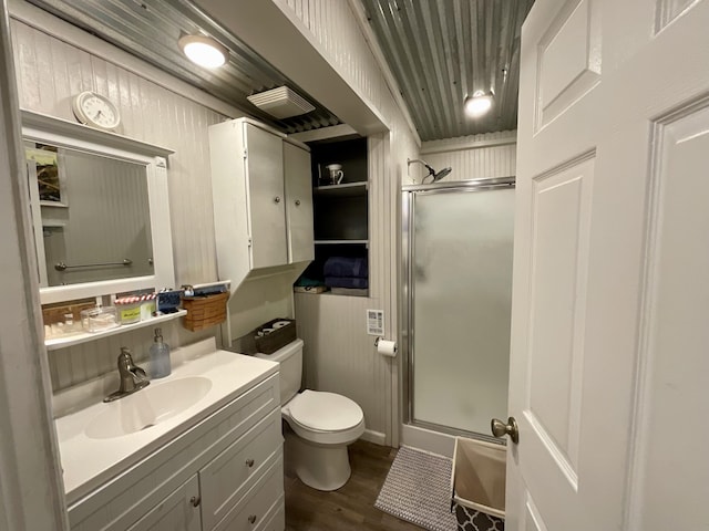 690 Ditch Gap Rd, Whitwell, TN 37397 - bathroom with toilet, a stall shower, vanity, wood finished floors, and baseboards