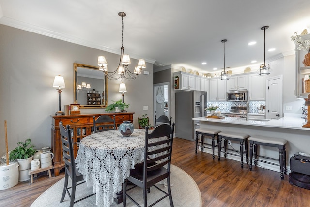 2311 Waterhaven Dr, Chattanooga, TN 37406 - dining space with ornamental molding, dark wood-style floors, a chandelier, and recessed lighting