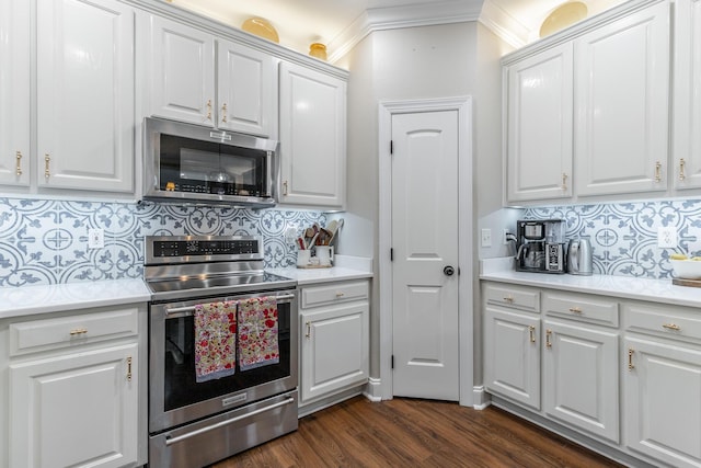 2311 Waterhaven Dr, Chattanooga, TN 37406 - kitchen with appliances with stainless steel finishes, decorative backsplash, white cabinets, and crown molding