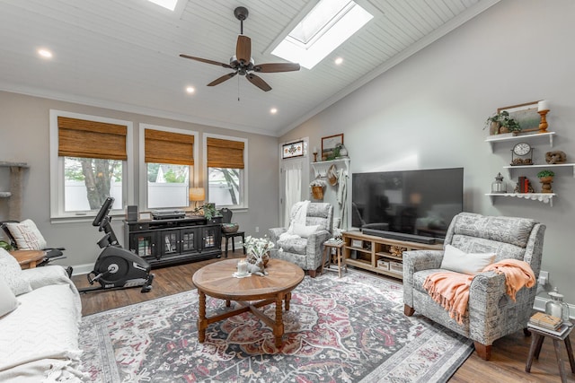 2311 Waterhaven Dr, Chattanooga, TN 37406 - living room featuring a skylight, lofted ceiling, wood finished floors, ceiling fan, and ornamental molding