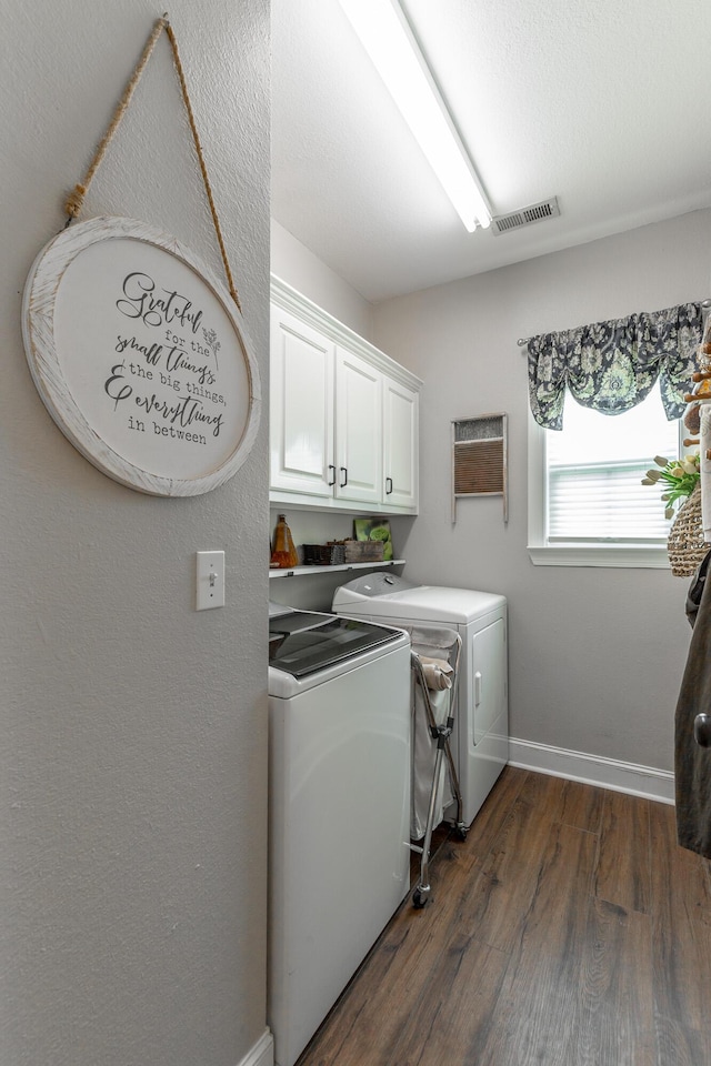 2311 Waterhaven Dr, Chattanooga, TN 37406 - laundry room with cabinet space, washer and dryer, and dark wood-style floors