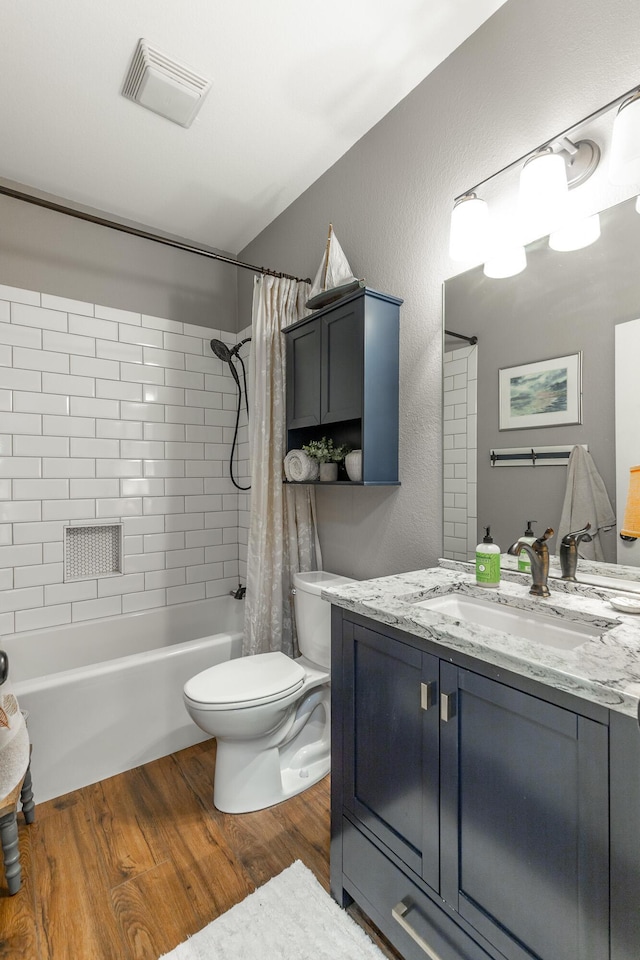 2311 Waterhaven Dr, Chattanooga, TN 37406 - bathroom featuring shower / bath combo, vanity, and wood finished floors