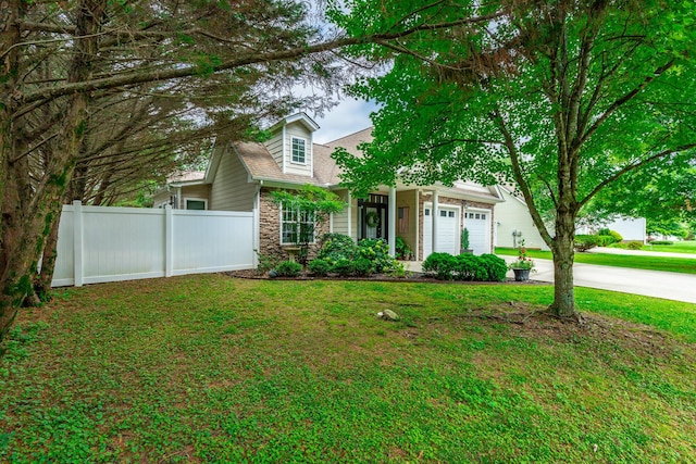 2311 Waterhaven Dr, Chattanooga, TN 37406 - view of front of home featuring stone siding, driveway, and an attached garage