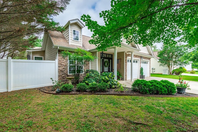 2311 Waterhaven Dr, Chattanooga, TN 37406 - view of front facade with driveway, stone siding, and an attached garage