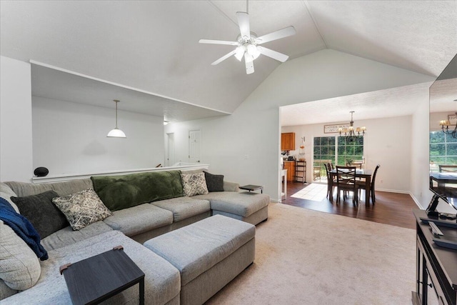487 Ridge Rd, Lafayette, GA 30728 - living area with a chandelier, lofted ceiling, a ceiling fan, carpet, and wood finished floors