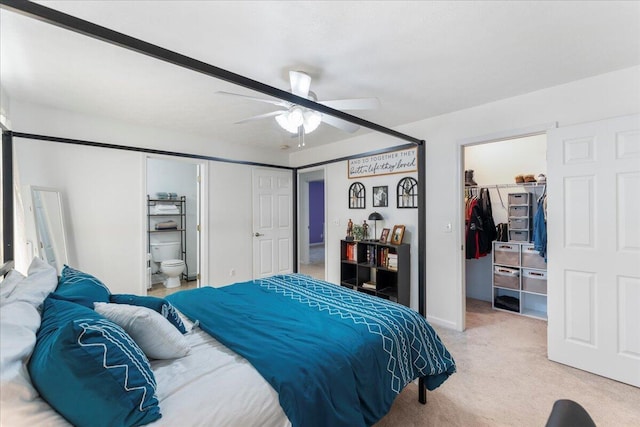 487 Ridge Rd, Lafayette, GA 30728 - bedroom with a spacious closet, light colored carpet, a closet, and ceiling fan