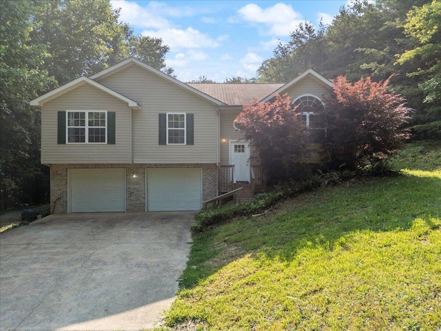 487 Ridge Rd, Lafayette, GA 30728 - view of front of home with driveway, a garage, a front yard, and brick siding