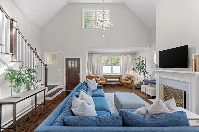 410 Stringer St, Chattanooga, TN 37405 - living room with a chandelier, stairs, high vaulted ceiling, plenty of natural light, and wood finished floors