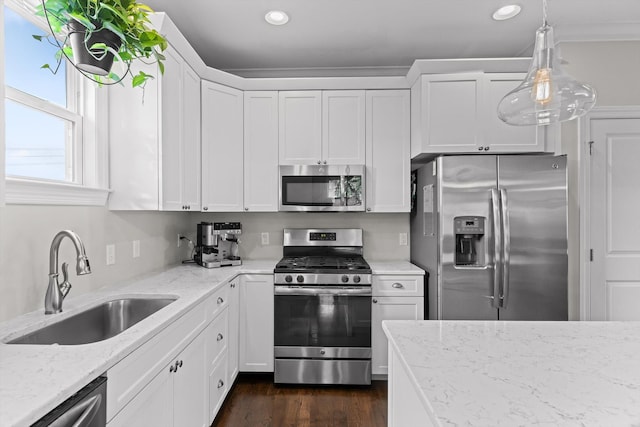 410 Stringer St, Chattanooga, TN 37405 - kitchen with appliances with stainless steel finishes, a sink, recessed lighting, white cabinetry, and light stone counters