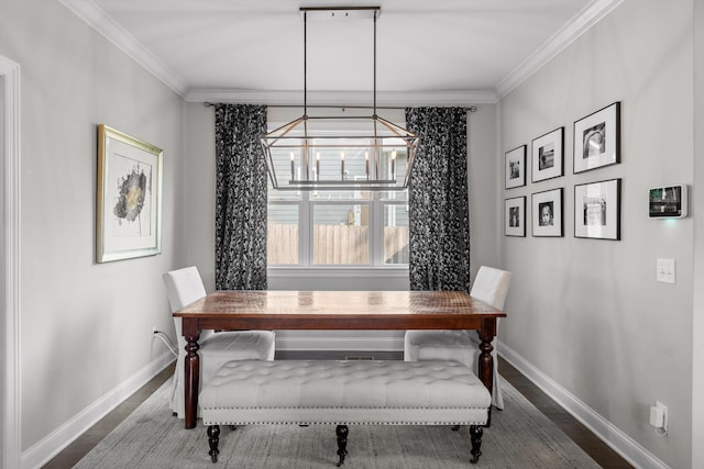 410 Stringer St, Chattanooga, TN 37405 - dining room featuring wood finished floors, ornamental molding, baseboards, and a chandelier