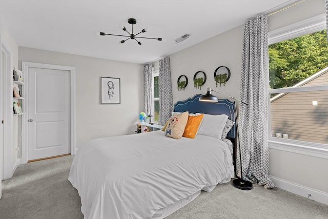 410 Stringer St, Chattanooga, TN 37405 - bedroom with carpet, baseboards, and a chandelier