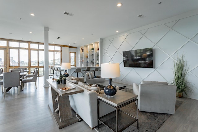 200 Manufacturers Rd Apt 507, Chattanooga, TN 37405 - living room with wood finished floors, floor to ceiling windows, and recessed lighting