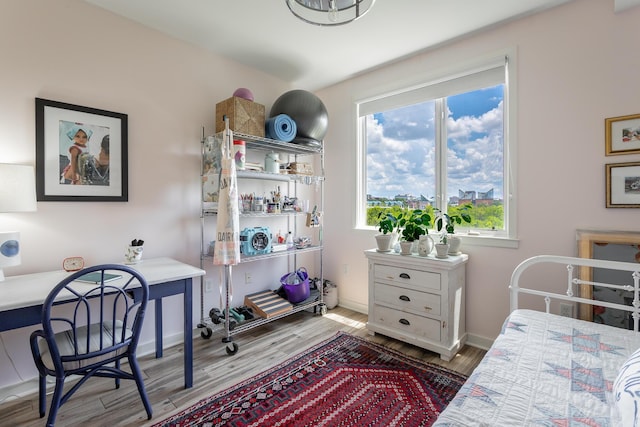 200 Manufacturers Rd Apt 507, Chattanooga, TN 37405 - bedroom with wood finished floors, multiple windows, and an office area