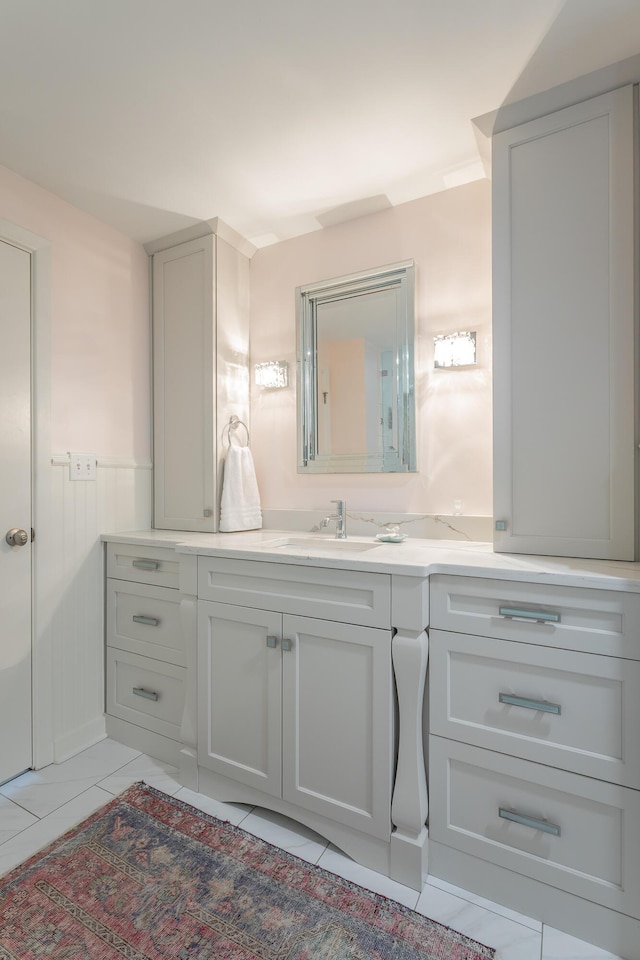 200 Manufacturers Rd Apt 507, Chattanooga, TN 37405 - bathroom featuring vanity, tile patterned floors, and wainscoting