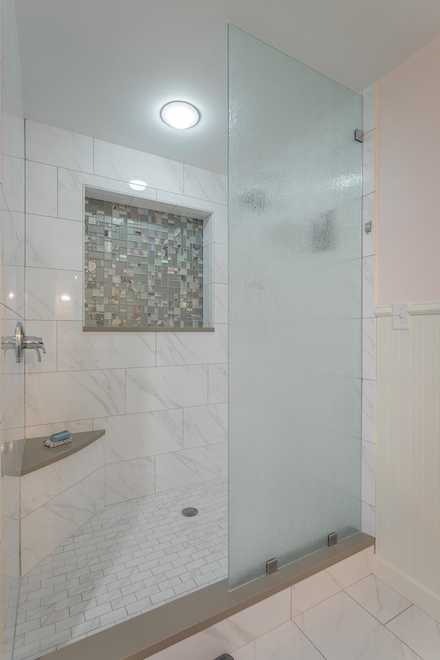 200 Manufacturers Rd Apt 507, Chattanooga, TN 37405 - bathroom featuring a tile shower and marble look tile flooring