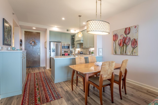 200 Manufacturers Rd Apt 507, Chattanooga, TN 37405 - dining space featuring wood finished floors and recessed lighting