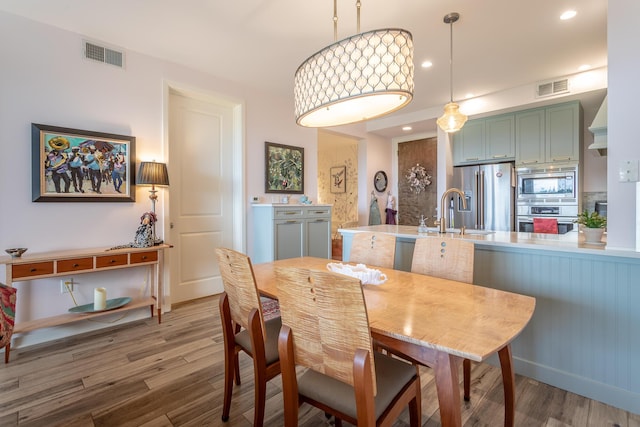 200 Manufacturers Rd Apt 507, Chattanooga, TN 37405 - dining space featuring wood finished floors and recessed lighting