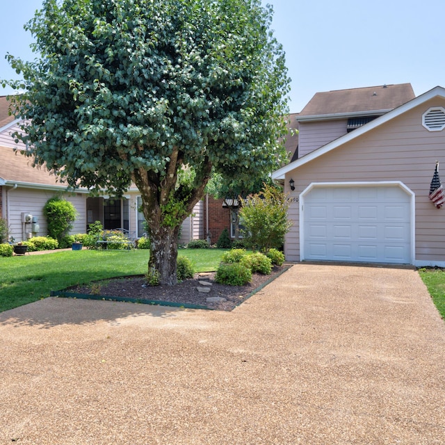 6590 Hickory Brook Rd, Chattanooga, TN 37421 - view of front of house featuring driveway, a front yard, and a garage