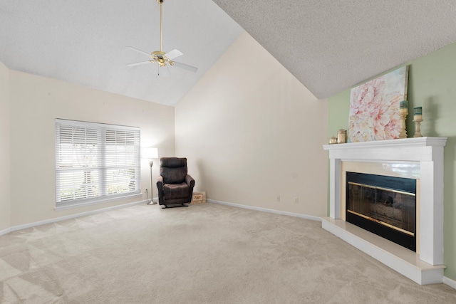 6590 Hickory Brook Rd, Chattanooga, TN 37421 - unfurnished room featuring carpet floors, a ceiling fan, a glass covered fireplace, high vaulted ceiling, and baseboards