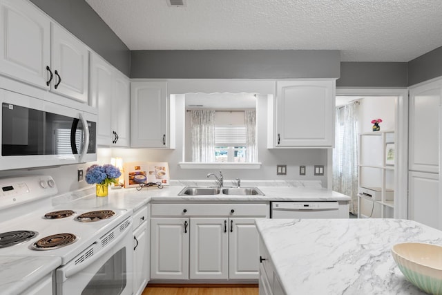 6590 Hickory Brook Rd, Chattanooga, TN 37421 - kitchen featuring white appliances, a sink, white cabinets, and a textured ceiling