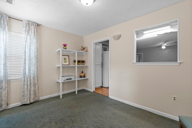 6590 Hickory Brook Rd, Chattanooga, TN 37421 - bedroom with carpet, a textured ceiling, baseboards, and refrigerator
