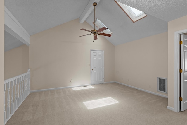6590 Hickory Brook Rd, Chattanooga, TN 37421 - additional living space featuring a skylight, light carpet, beamed ceiling, a ceiling fan, and baseboards