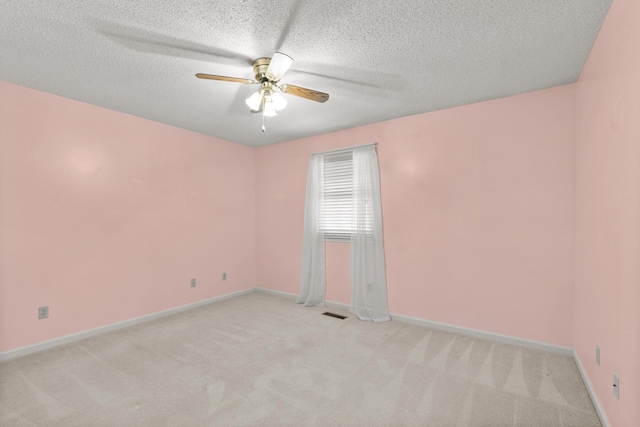6590 Hickory Brook Rd, Chattanooga, TN 37421 - empty room featuring light carpet, a ceiling fan, baseboards, and a textured ceiling
