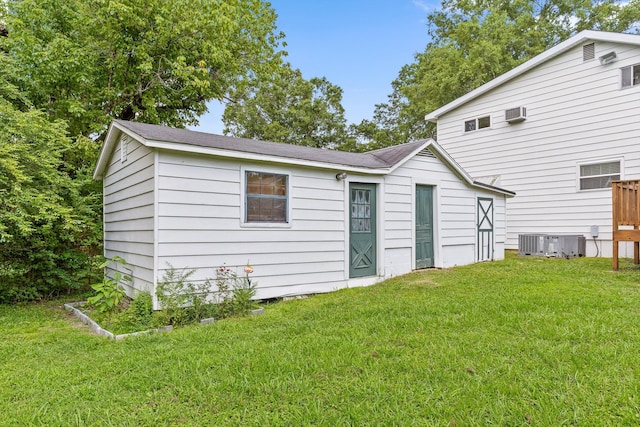 1907 Mcbrien Rd, Chattanooga, TN 37412 - back of property with a yard and a wall mounted AC