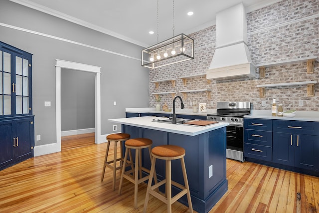 208 E Villanow St, Lafayette, GA 30728 - kitchen featuring blue cabinets, stainless steel electric range, premium range hood, light countertops, and open shelves