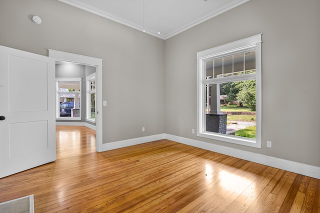 208 E Villanow St, Lafayette, GA 30728 - empty room with crown molding, light wood-type flooring, baseboards, and a smoke detector