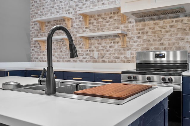 208 E Villanow St, Lafayette, GA 30728 - kitchen with blue cabinets, custom range hood, electric stove, and light countertops
