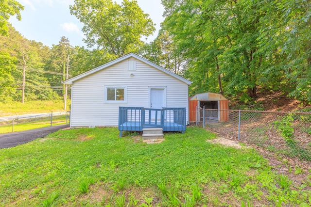 1806 Dallas Lake Rd, Soddy Daisy, TN 37379 - rear view of property with an outbuilding and a deck