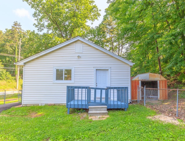 1806 Dallas Lake Rd, Soddy Daisy, TN 37379 - back of property featuring a wooden deck and an outdoor structure
