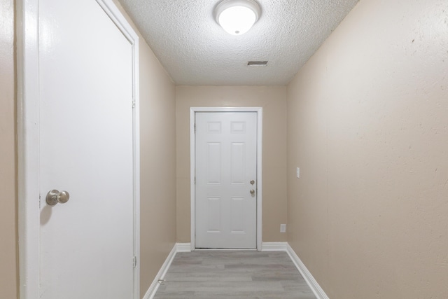 1806 Dallas Lake Rd, Soddy Daisy, TN 37379 - entryway featuring light wood-style floors, a textured ceiling, and baseboards