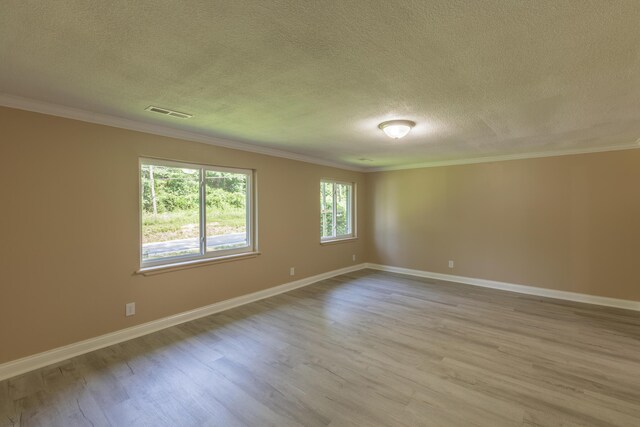 1806 Dallas Lake Rd, Soddy Daisy, TN 37379 - unfurnished room with a textured ceiling, wood finished floors, ornamental molding, and baseboards