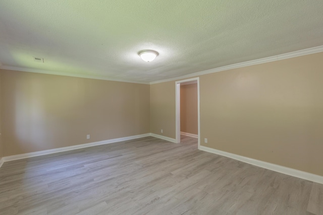 1806 Dallas Lake Rd, Soddy Daisy, TN 37379 - spare room featuring light wood-style flooring, a textured ceiling, crown molding, and baseboards