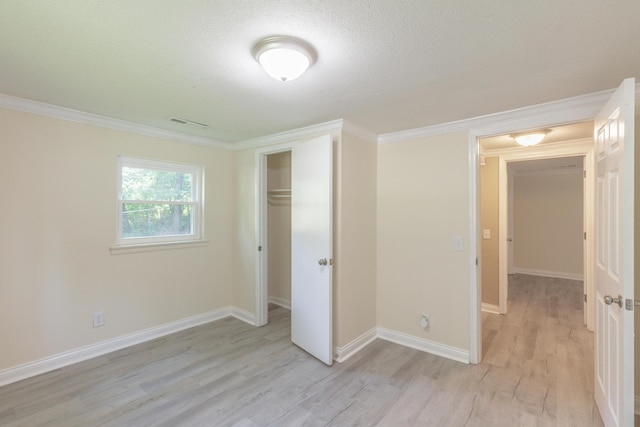 1806 Dallas Lake Rd, Soddy Daisy, TN 37379 - unfurnished bedroom with light wood-style floors, ornamental molding, baseboards, and a closet