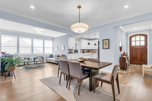9257 Skyfall Dr, Ooltewah, TN 37363 - dining area with light wood finished floors, crown molding, and recessed lighting