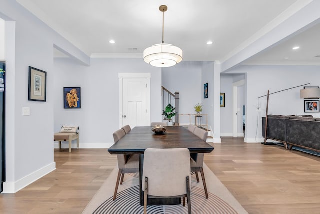 9257 Skyfall Dr, Ooltewah, TN 37363 - dining area featuring light wood-type flooring, crown molding, baseboards, stairway, and recessed lighting