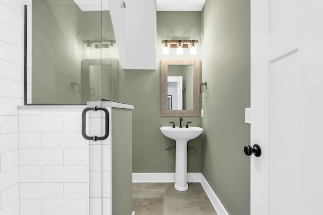 9257 Skyfall Dr, Ooltewah, TN 37363 - full bath featuring baseboards, a stall shower, and a sink