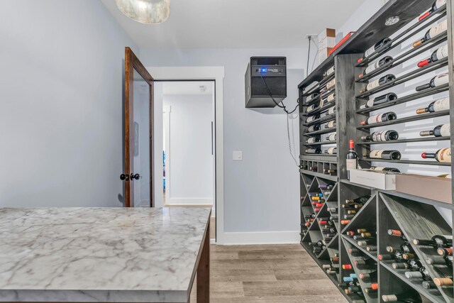 9257 Skyfall Dr, Ooltewah, TN 37363 - wine room featuring wood finished floors and baseboards