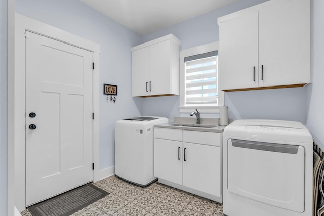 9257 Skyfall Dr, Ooltewah, TN 37363 - laundry room featuring cabinet space, separate washer and dryer, and baseboards