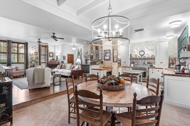 1000 E Martin Luther King Blvd Unit 102, Chattanooga, TN 37403 - dining space featuring beamed ceiling, a chandelier, ceiling fan, and light tile patterned floors