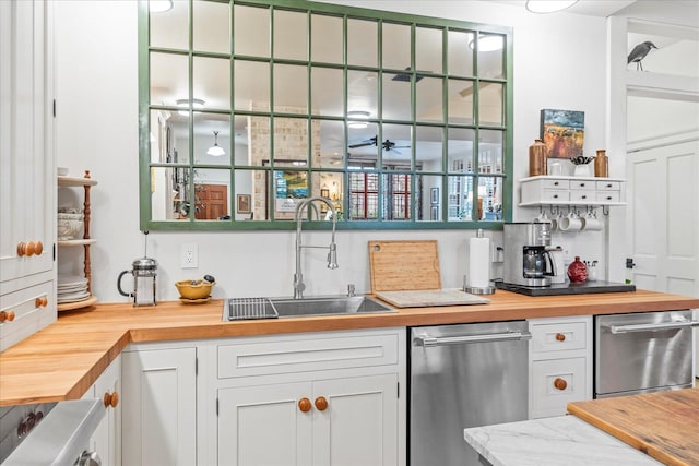 1000 E Martin Luther King Blvd Unit 102, Chattanooga, TN 37403 - kitchen with wood counters, stainless steel dishwasher, and white cabinetry