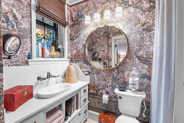 1000 E Martin Luther King Blvd Unit 102, Chattanooga, TN 37403 - bathroom with wallpapered walls and vanity